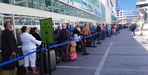 In May, cruise ship passengers waited 90 minutes for a taxi, forming a line 600 feet long.