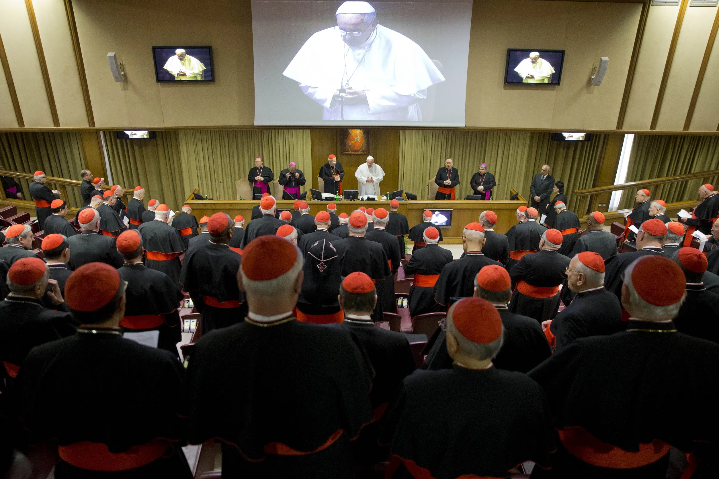 Pope Francis prays during a special consistory with cardinals and bishops, in the Synod hall at the Vatican, Thursday, Feb. 12, 2015.  (AP Photo/Andrew Medichini)
