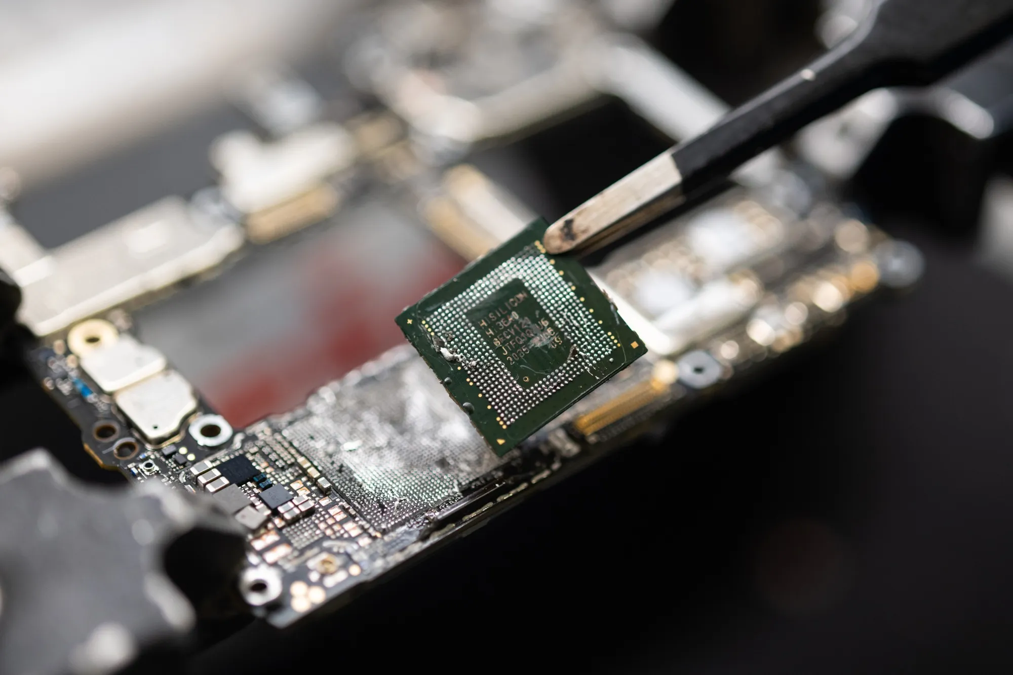 A chip taken from a Huawei smartphone.