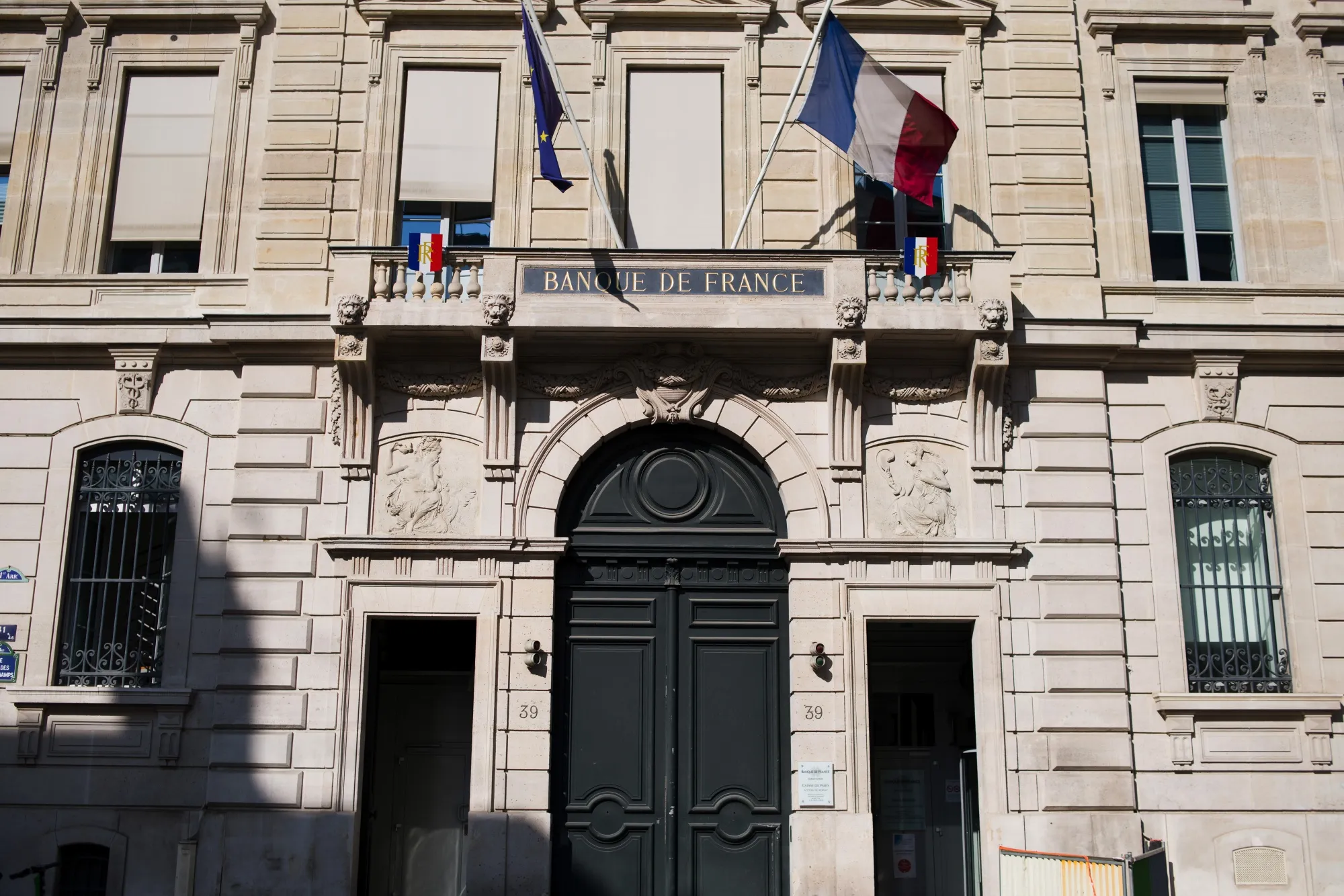 French national flags fly outside the Banque de France in Paris.