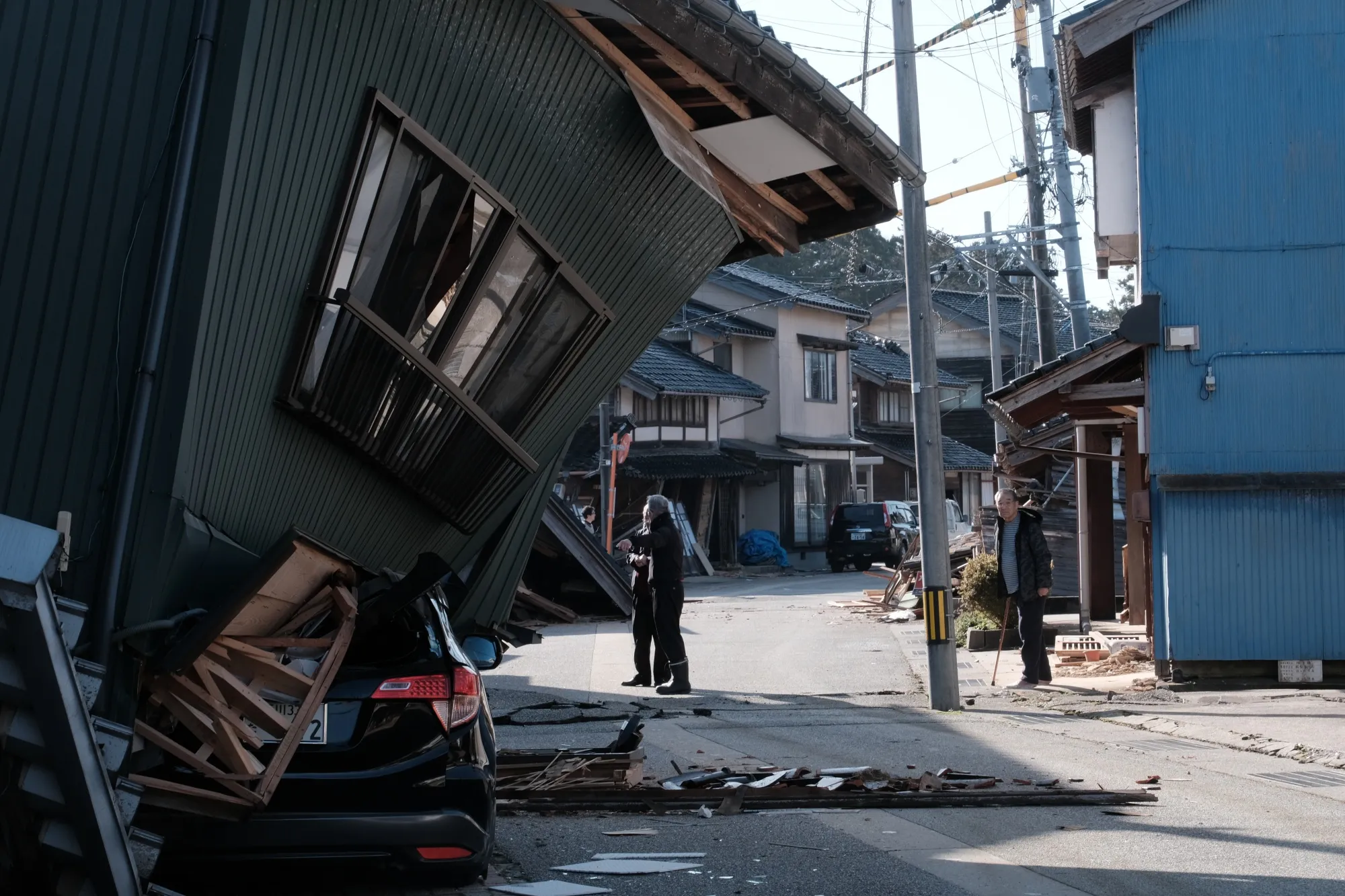 A damaged vehicle under a collapsed house following an earthquake in Nanao, Ishikawa Prefecture on Jan. 2.