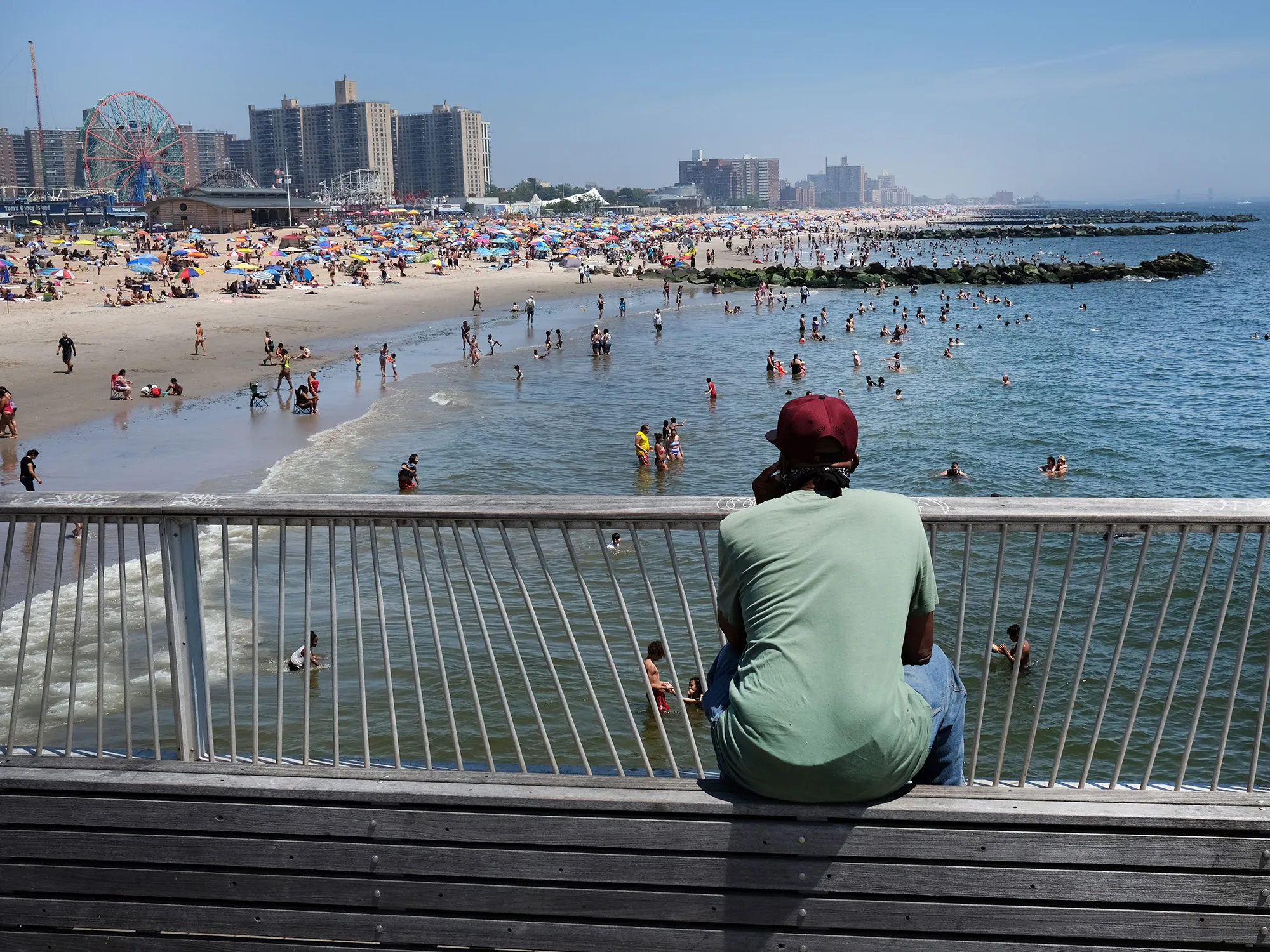 People visit the beach at Coney Island in Brooklyn, New York on July 19.