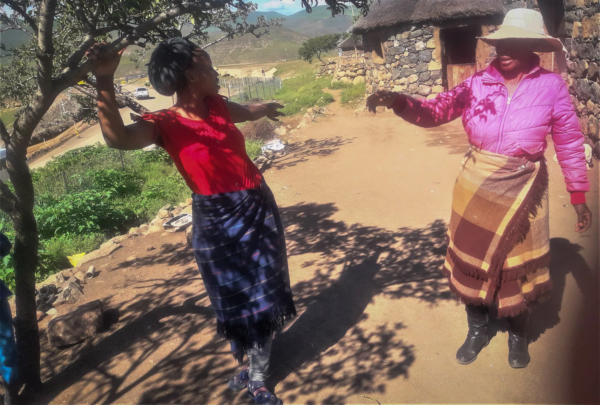 Mrs Mapuso Lengoasa pointing at the direction of their fields affected by water project