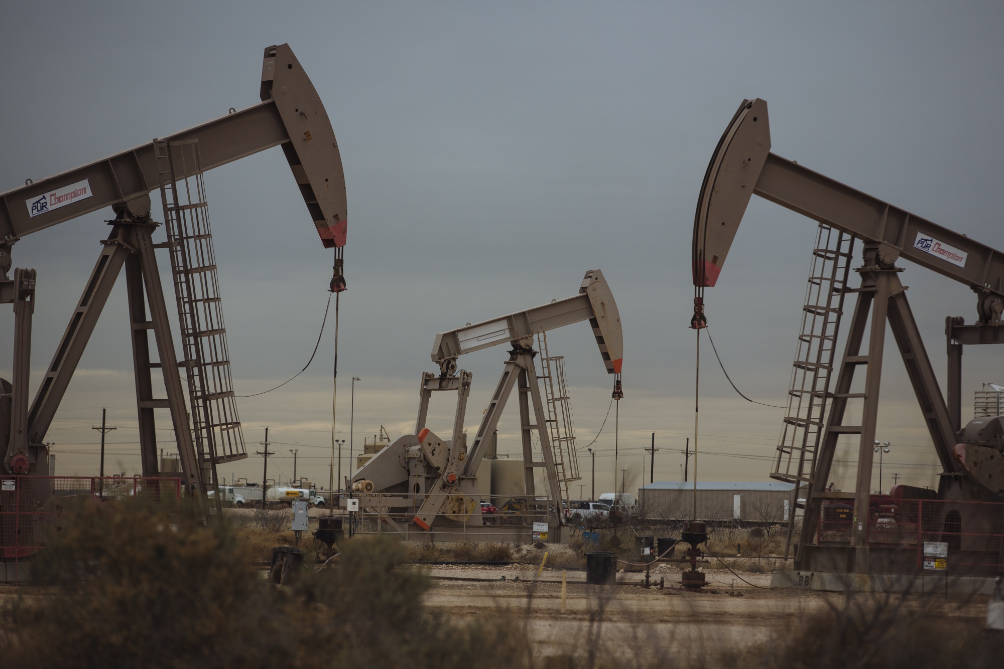 Pump Jacks extract crude oil from oil wells in Midland, Texas, U.S.