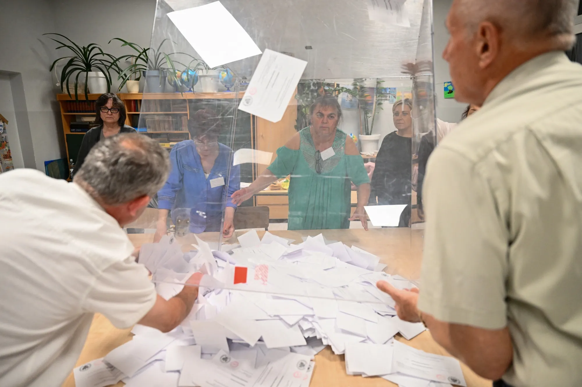 Poll workers empty the ballot boxes at a primary school before they are counted during the presidential elections in Gdansk, on June 1.