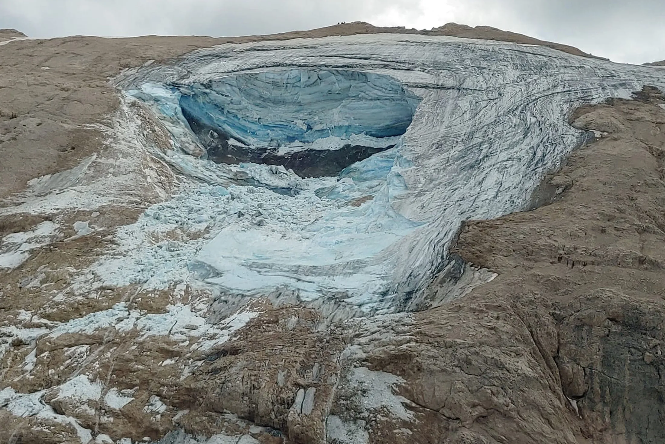 A large chunk of glacier which has broken loose, killing at least six hikers and injuring eight others in Italy's Alps near Trento&nbsp;on July 3.