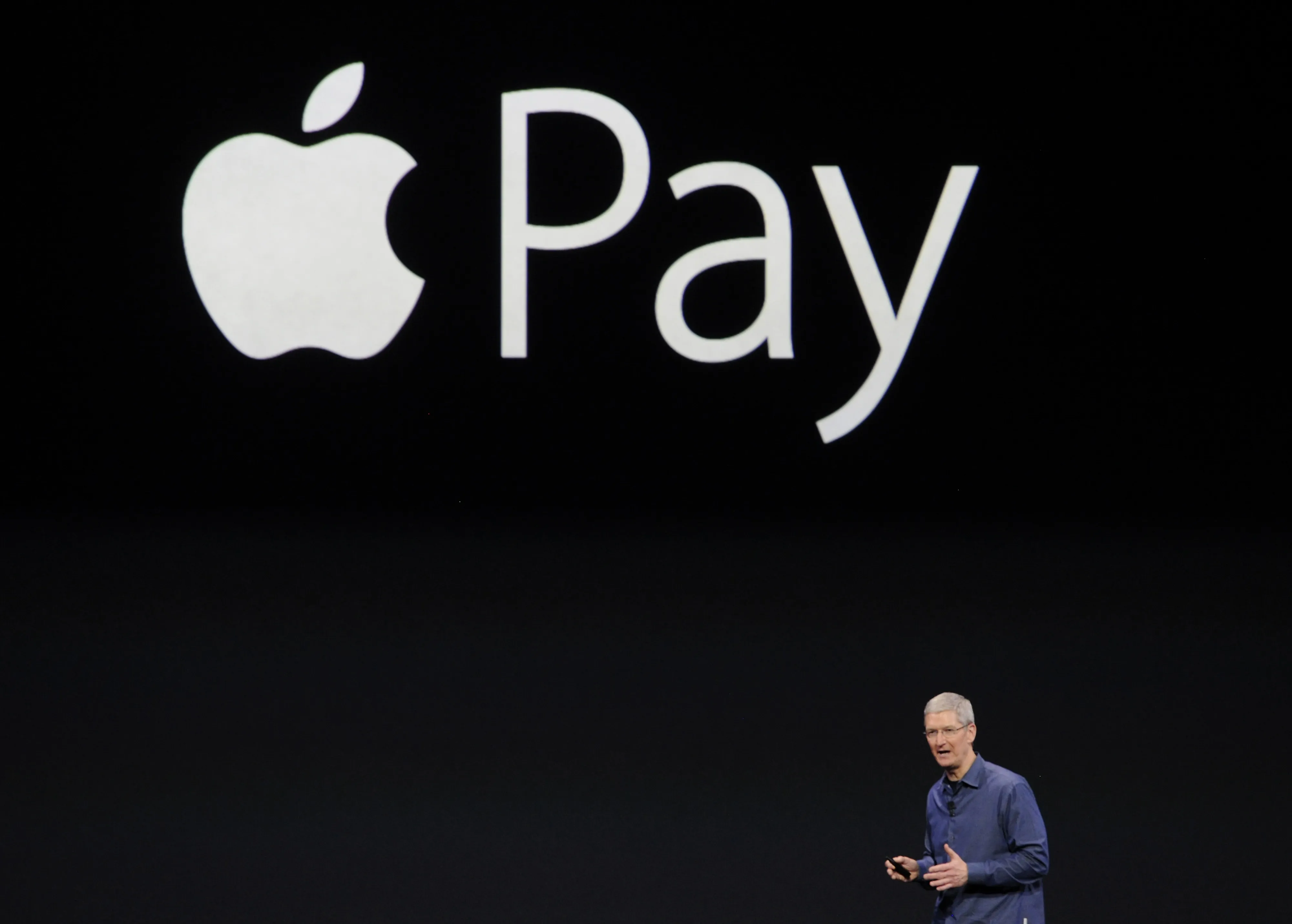 Tim Cook, chief executive officer of Apple, unveils the Apple Pay during a product announcement at Flint Center in Cupertino, California, on Sept. 9, 2014.
