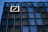 A logo sits illuminated on a new Deutsche Bank AG office building in Frankfurt, Germany, on Monday, Nov. 6, 2017. Demand for offices in Frankfurt and prime rents have climbed to a record as the city emerges as one of the favorites to attract financial firms from London in the run-up to the U.K.’s exit from the European Union, according to lobby group Frankfurt Main Finance.