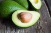 Ripe avocado on a wooden background