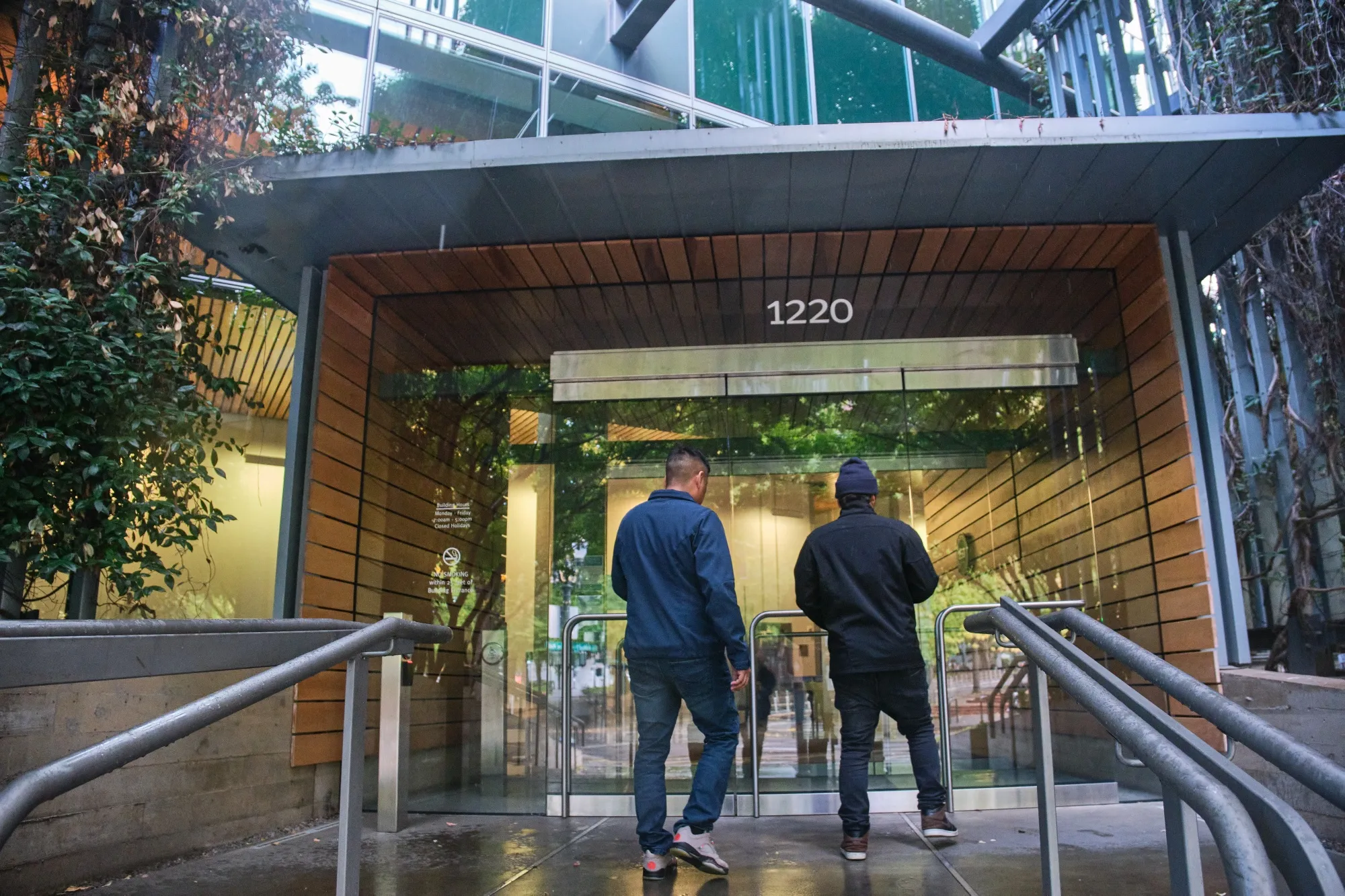 Asylum-seekers take their paperwork to the Edith Green-Wendell Wyatt Federal Building.