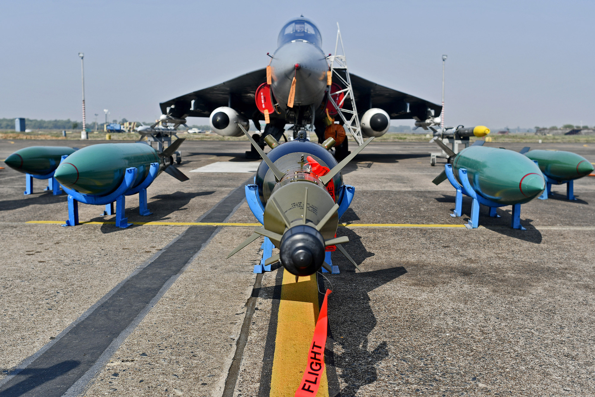 Missiles sit on the tarmac in front of an Indian Air Force&nbsp;Tejas fighter jet, developed by Hindustan Aeronautics Ltd., at the Kalaikunda Air Force Station, West Bengal, India.