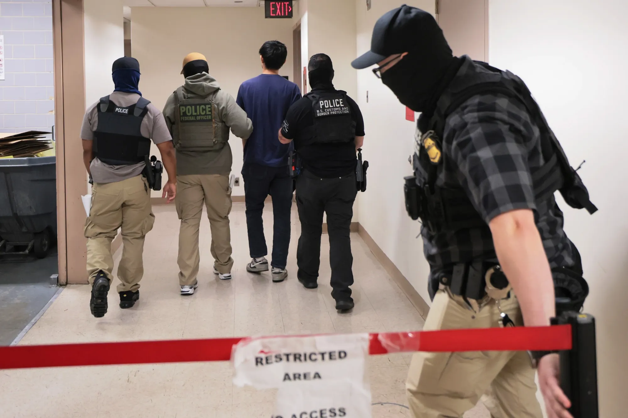 Federal agents detain a man after a hearing at the Jacob K. Javitz Federal Building in New York on July 23.&nbsp;
