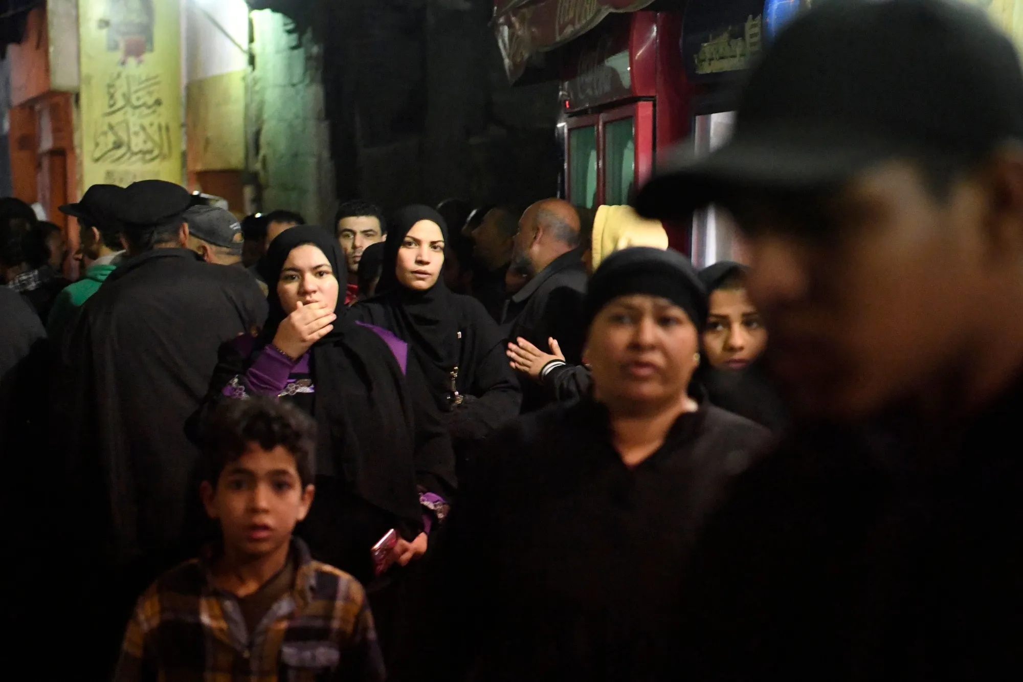 People react at the site of a suicide bombing in Cairo on Feb. 19.
