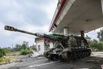 A Russian tank sits abandoned Friday on the outskirts of Izyum, eastern Ukraine.