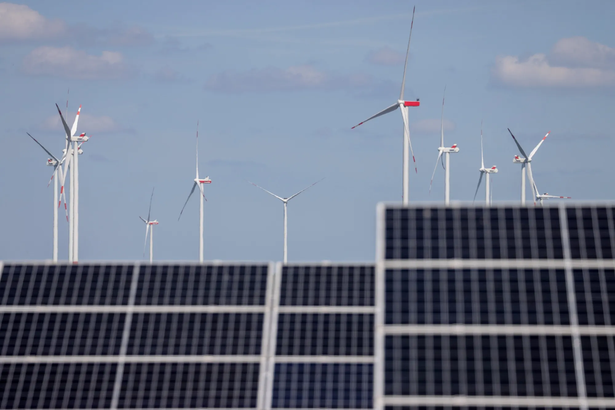 A wind farm and solar panels in Werneuchen, Germany.
