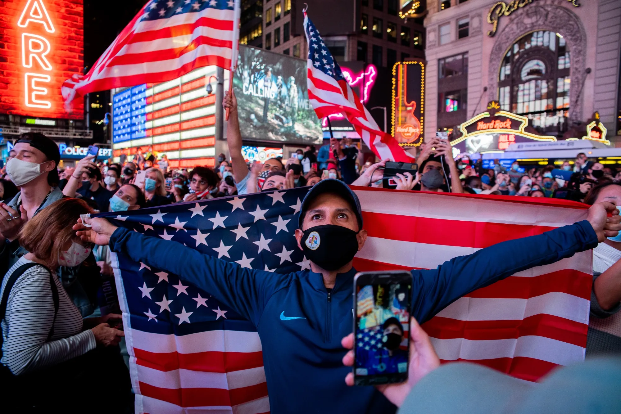 People celebrate as President-elect Joe Biden is declared the winner of the U.S. presidential election, in New York, U.S., on Saturday, Nov. 7, 2020.&nbsp;