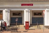 Franschhoek, Western cape, South Africa.2022. Exterior view of a post office, red letterbox and mailbox collection area.