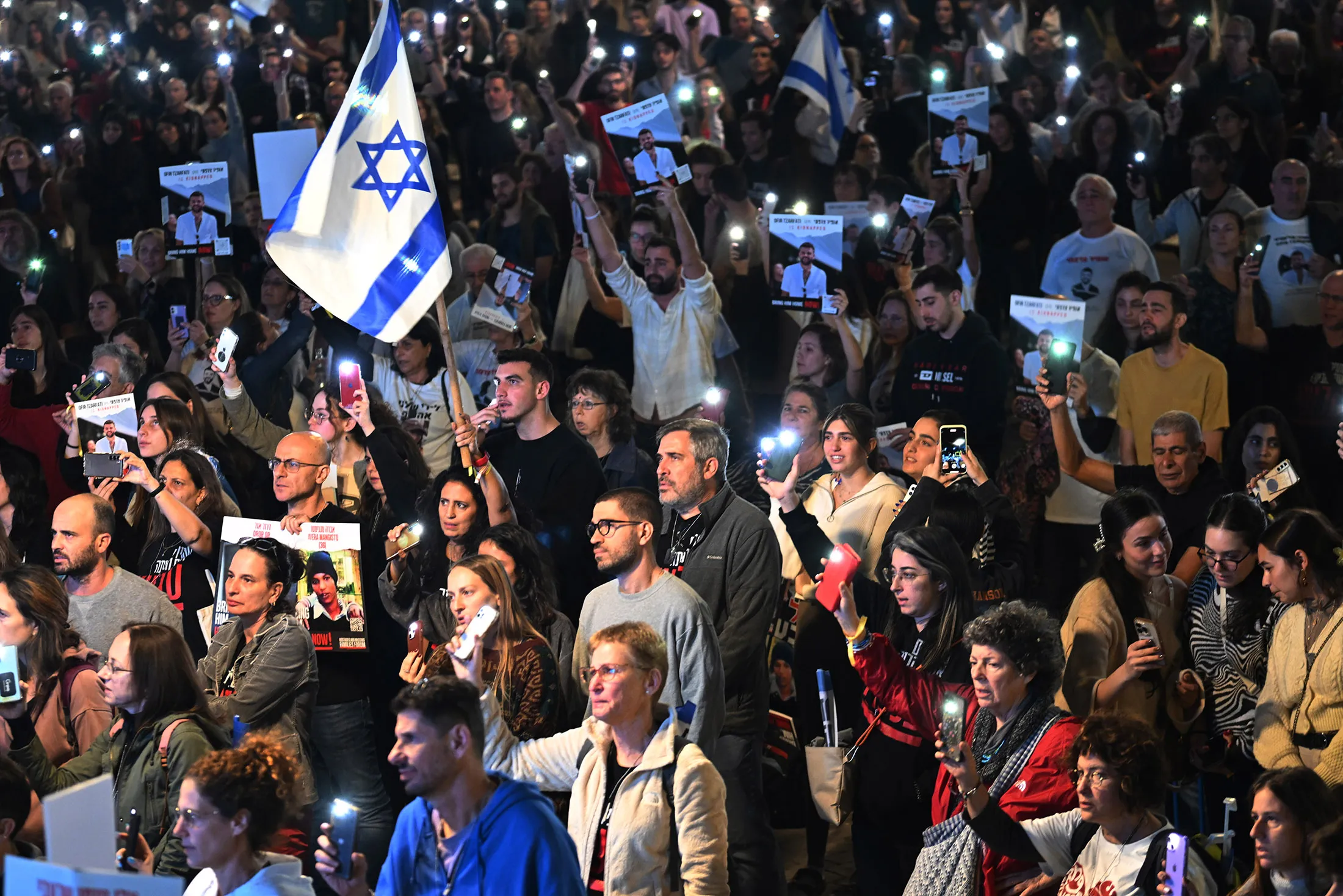 Israelis&nbsp;sing the national anthem during a&nbsp;rally in support of the 212 hostages that are still being held by Hamas, as another 13 hostages are supposed to be released, in Tel Aviv&nbsp;on Nov. 25.