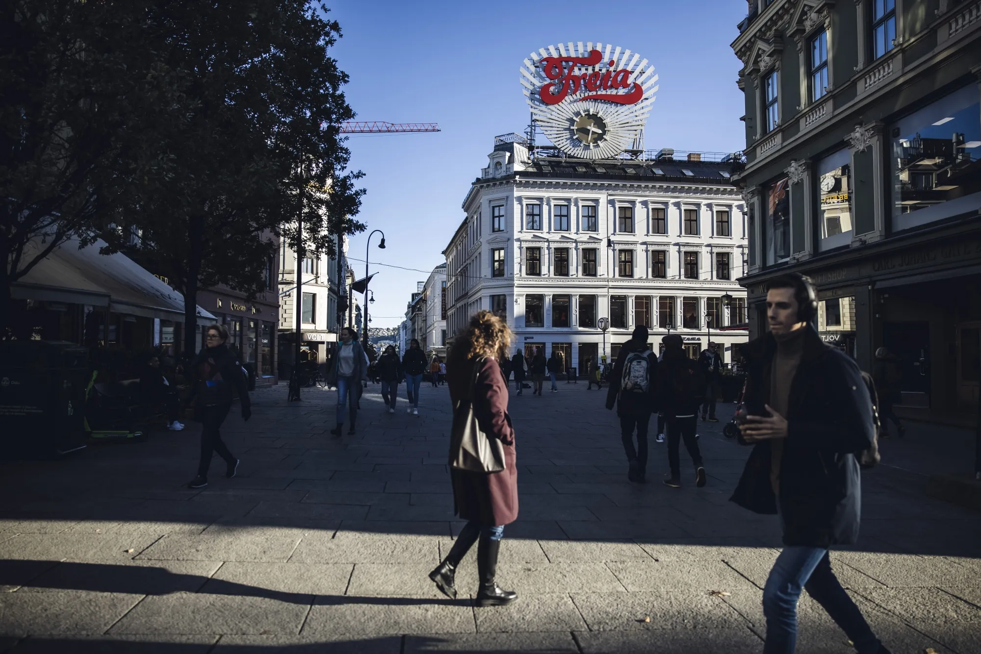 Shoppers walk along Karl Johans gate, the main shopping street in Oslo.