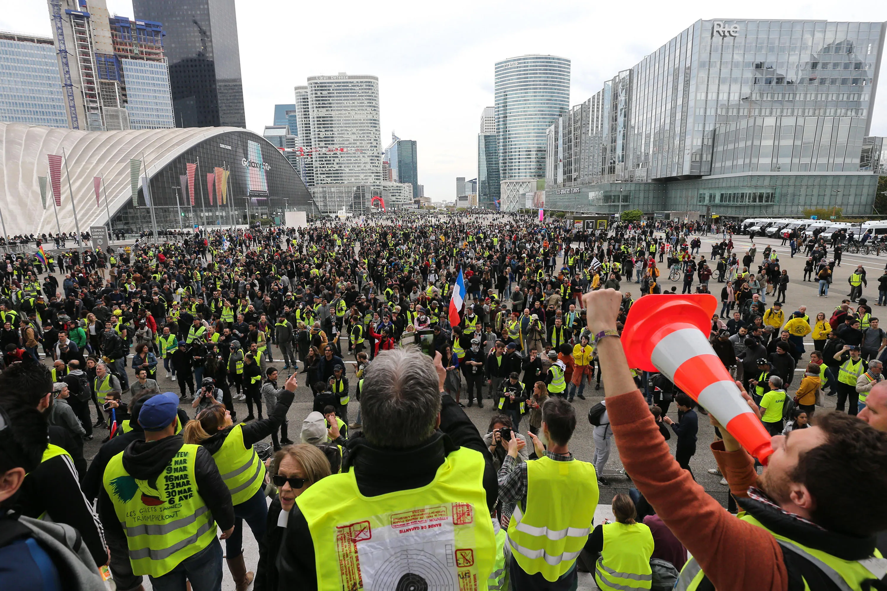 Protesters wearing a yellow vest gather in front of "La Grande Arche de la Defense"&nbsp;west of Paris, on April 6.