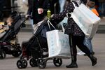 A shopper with a baby stroller on Alexanderplatz square in central Berlin, Germany, on Tuesday, Oct. 26, 2021.