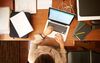 Top view shot of a businesswoman working on her laptop at home office
