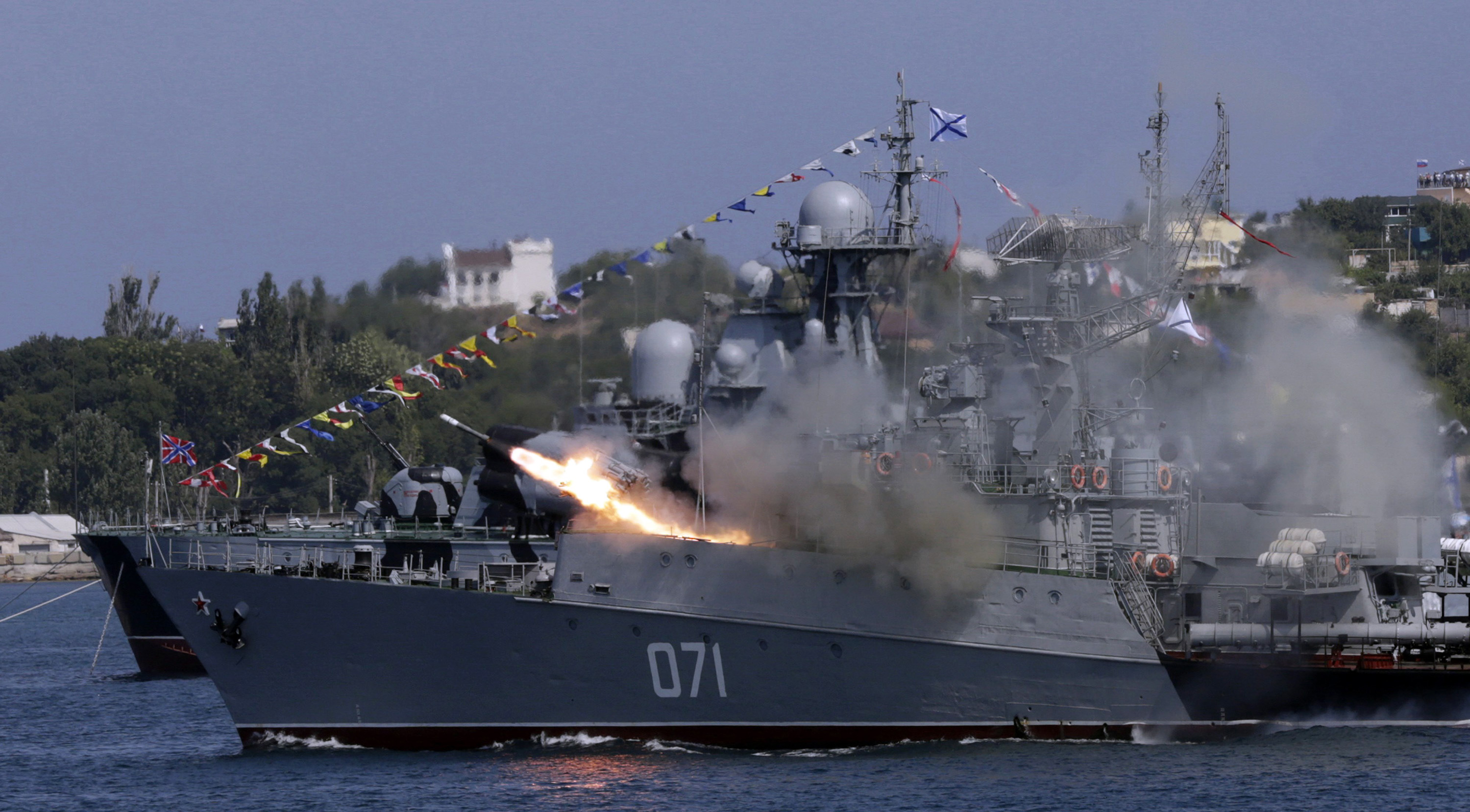 A Russian Navy ship fires missiles during Navy Day celebrations in Sevastopol in 2015.