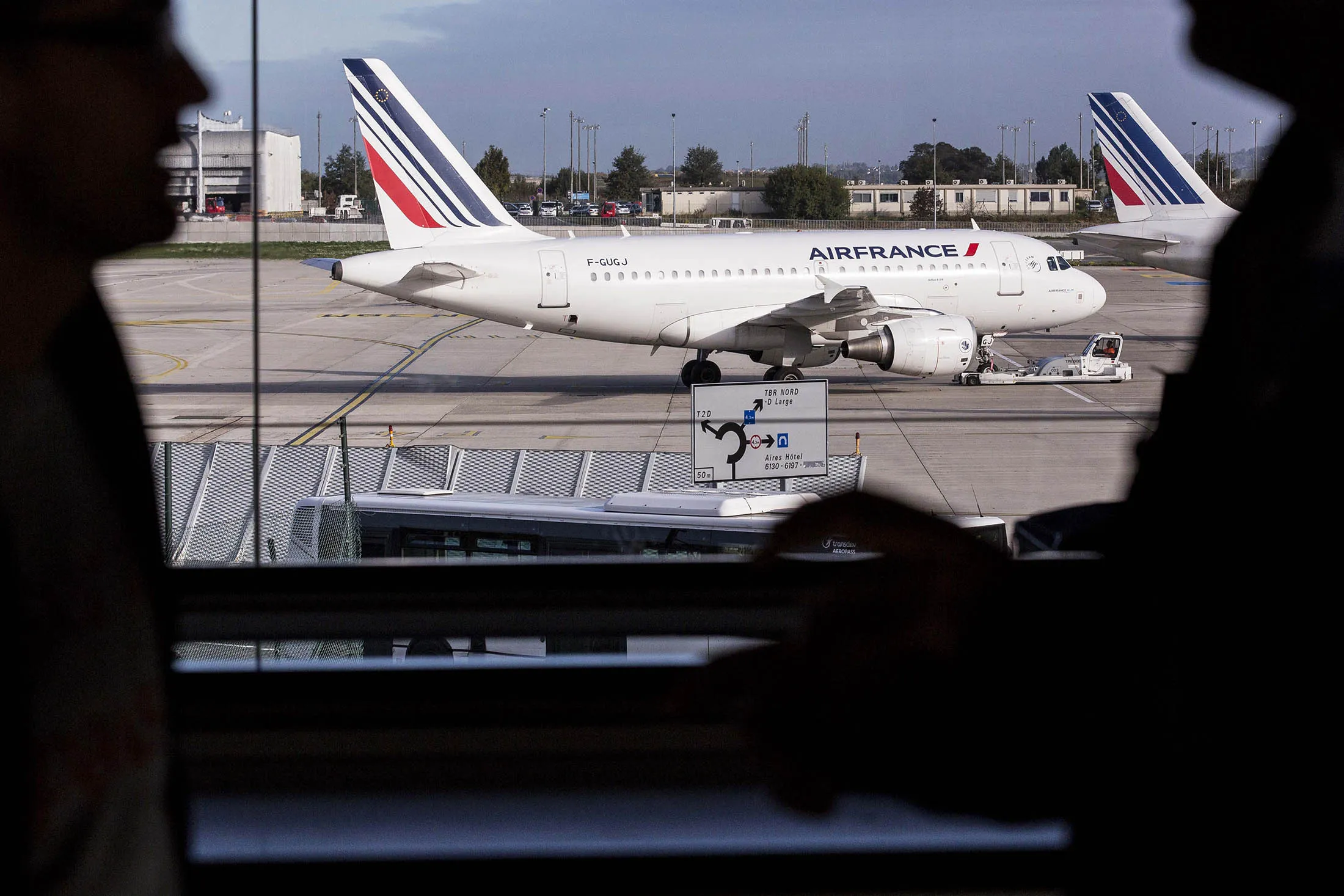 Air France passenger aircraft, operated by Air France-KLM Group, sit on the tarmac at Charles De Gaulle airport, in Roissy, France.
