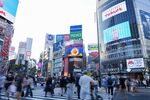 Billboard advertisements at a pedestrian crossing in Shibuya district in Tokyo. Photographer: Noriko Hayashi/Bloomberg