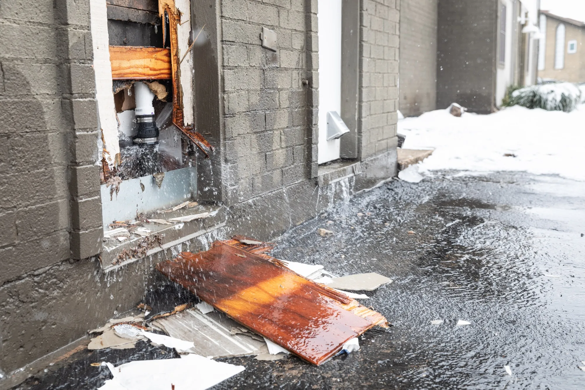 Water flows out from a burst water pipe in Austin, Texas, on Feb. 18.