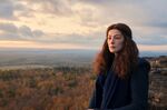 Rosamund Pike plays Moiraine, a magic-wielding adventurer who upends the lives of five young people in a small town.