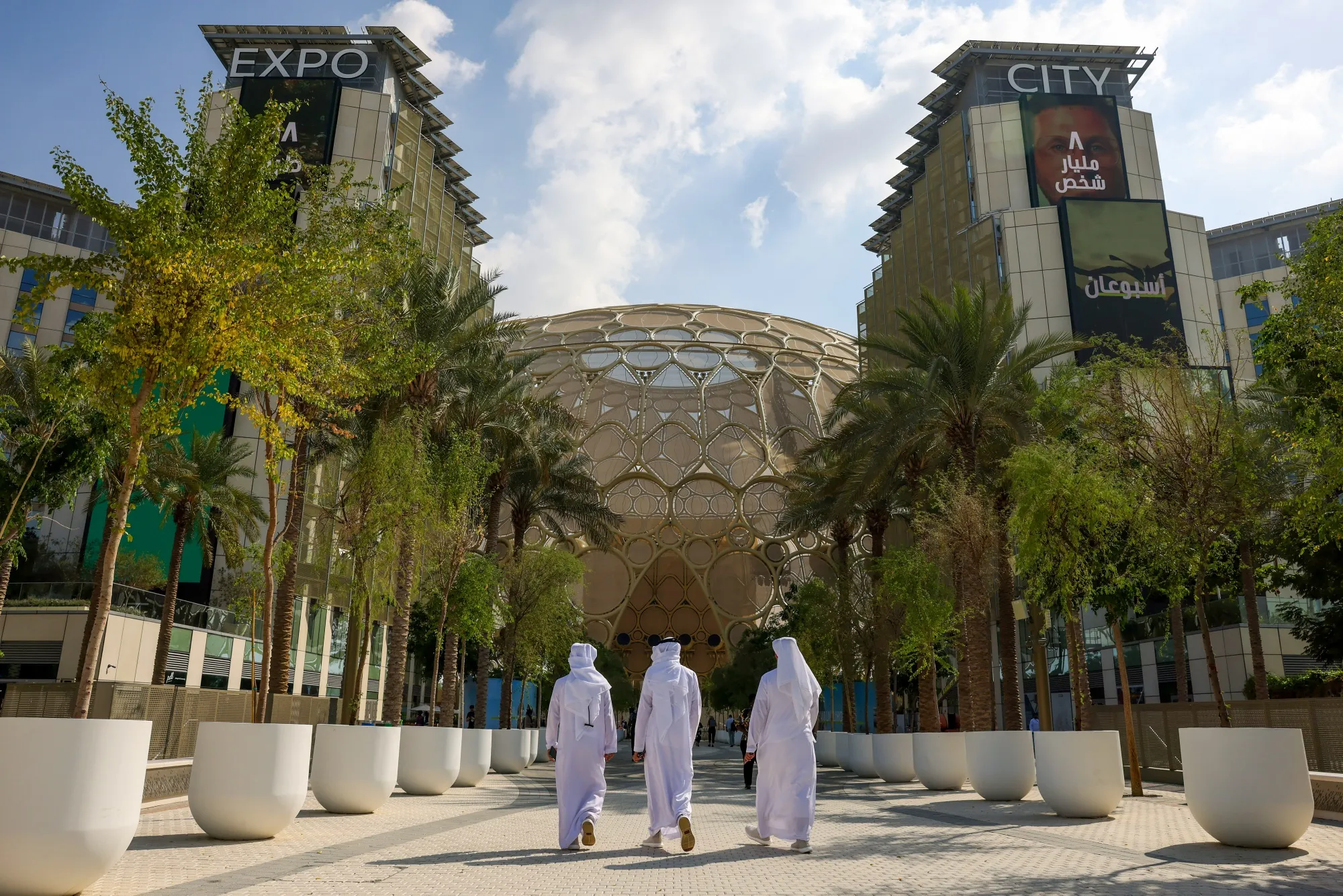Attendees walk through the campus in the Blue Zone.