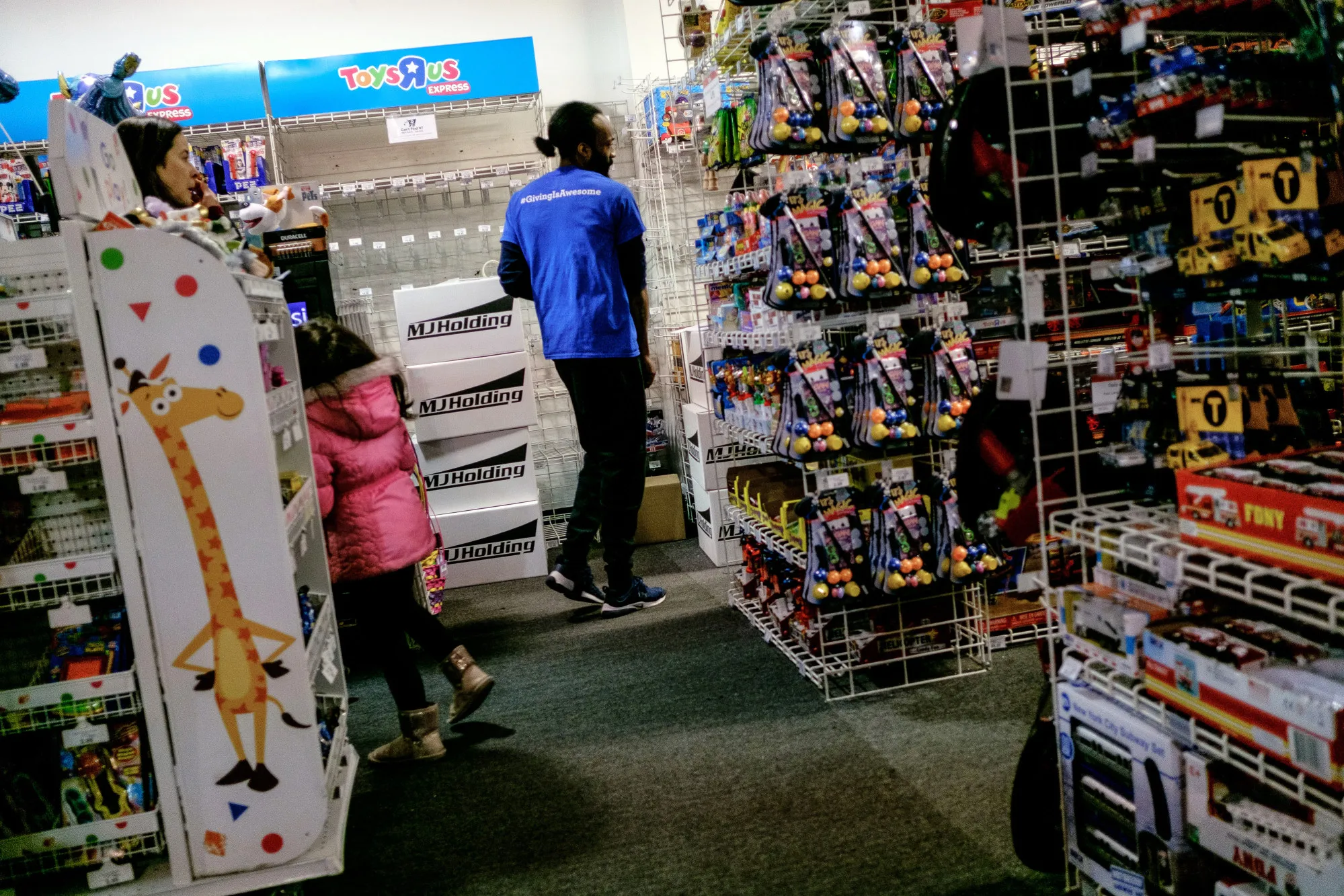 An employee walks through an aisle inside a Toys ‘R’ Us&nbsp;store in New York on&nbsp;March 15, 2018.&nbsp;