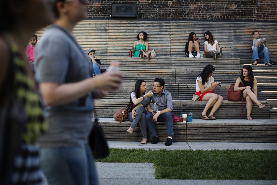 Pedestrians gather in a viewing area at the High Line in New York.