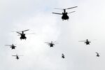 Japan Ground Self-Defense Force (JGSDF) helicopters fly during a live fire exercise at the foot of Mount Fuji in the Hataoka district of the East Fuji Maneuver Area in Gotemba, Shizuoka Prefecture, Japan.