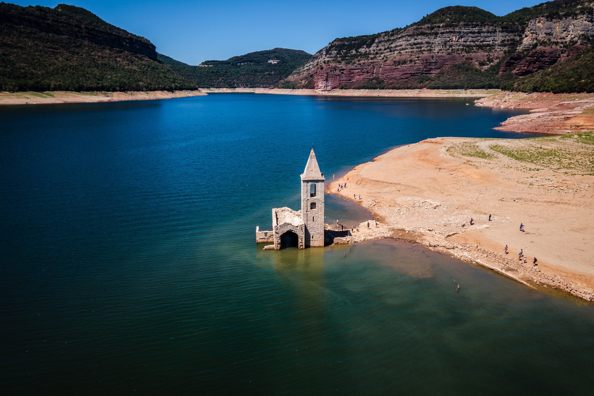 Ruins of the Sant Roma church, exposed by low water levels in the Sau reservoir following drought, in Vilanova de Sau, Spain, on Aug. 20, 2022.