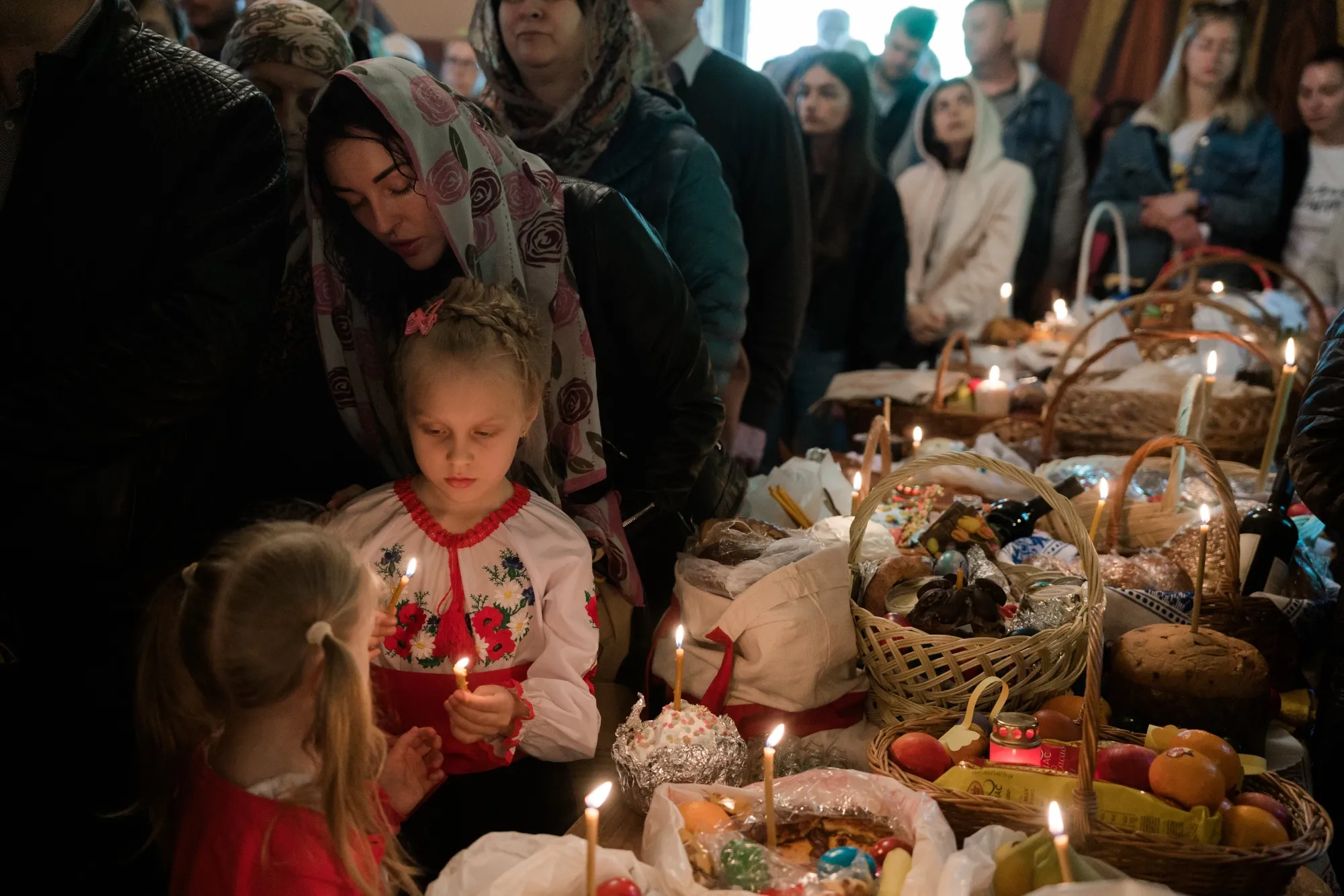 Ukrainian refugees and residents attend an Orthodox Easter service&nbsp;in Bucharest, Romania, on April 24.
