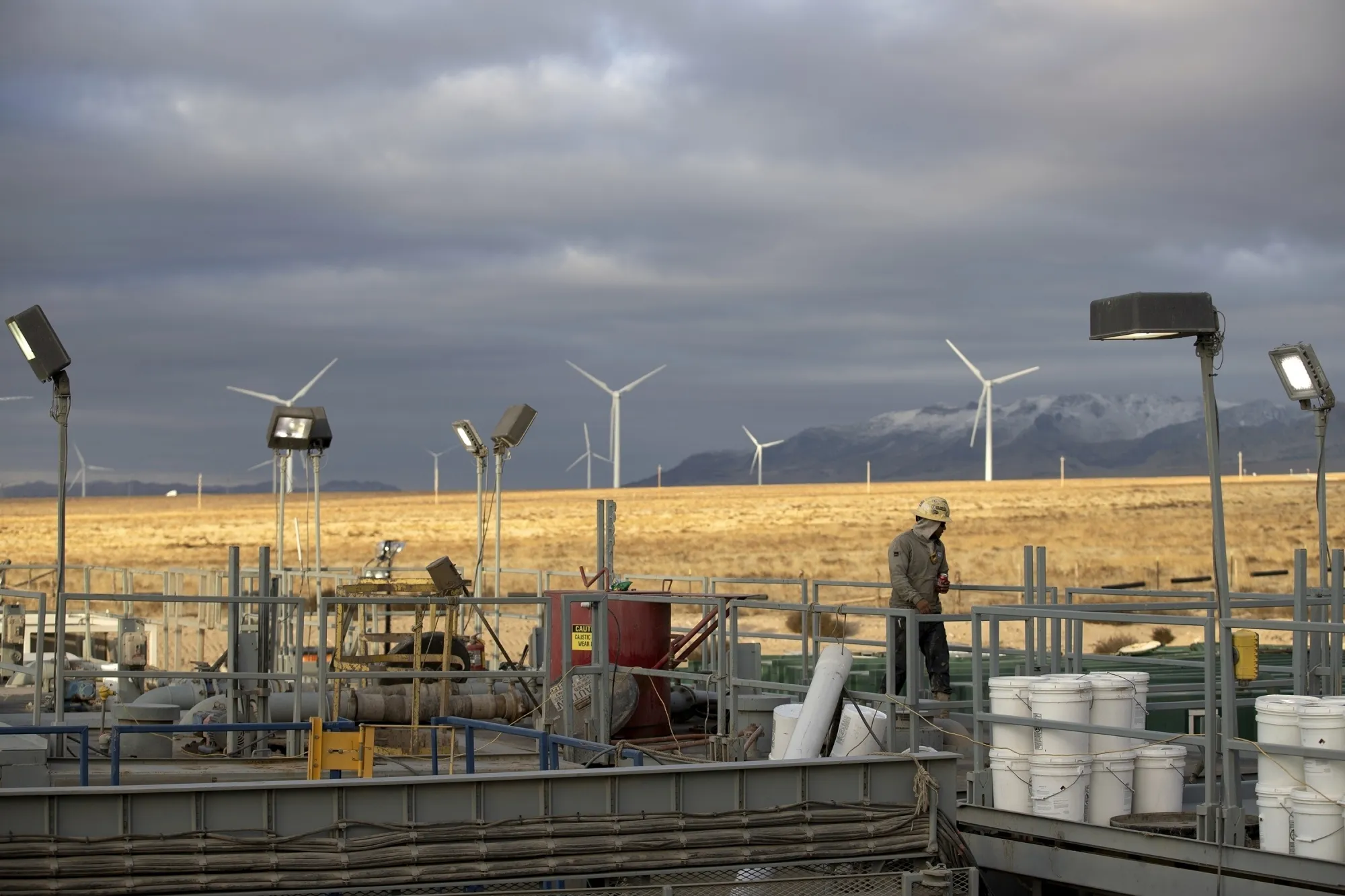 A rig operator walks through a Fervo Energy geothermal drilling site near Milford, Utah.