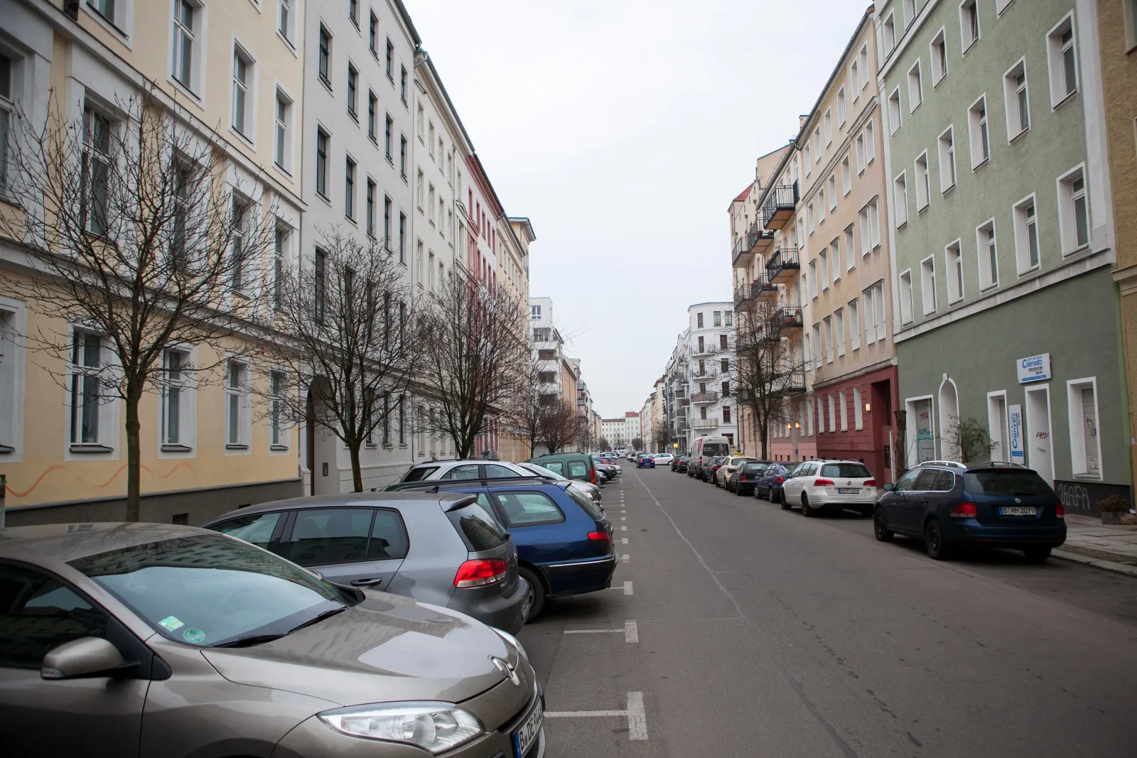 Automobiles sit parked outside residential property in Berlin.