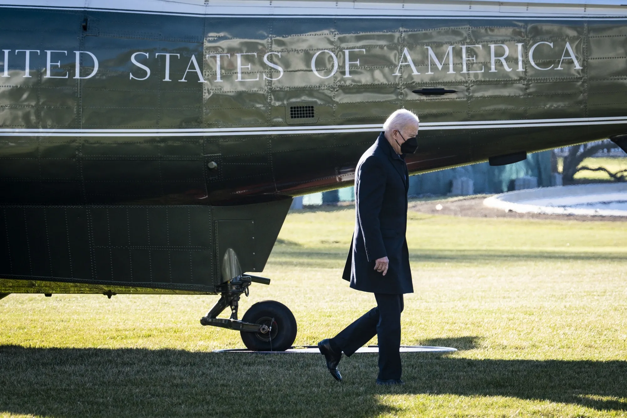 Joe Biden walks on the South Lawn of the White House after arriving on Marine One in Washington, D.C., on Dec. 20.