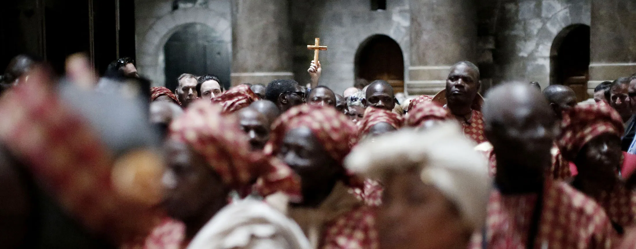 Nigerian pilgrims wait outside the Tomb of Jesus during their visit at the Holy Sepulchre in Jerusalem's Old City.
