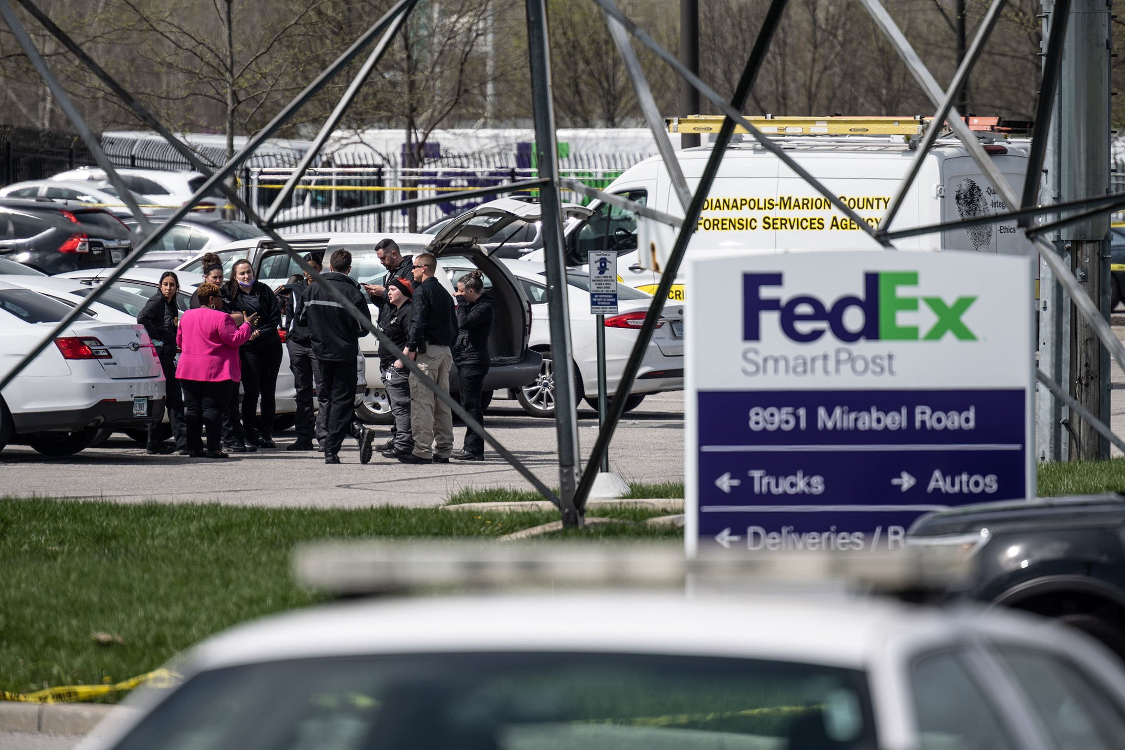 Crime scene investigators gather after a shooting at a FedEx SmartPost in Indianapolis on April 16.
