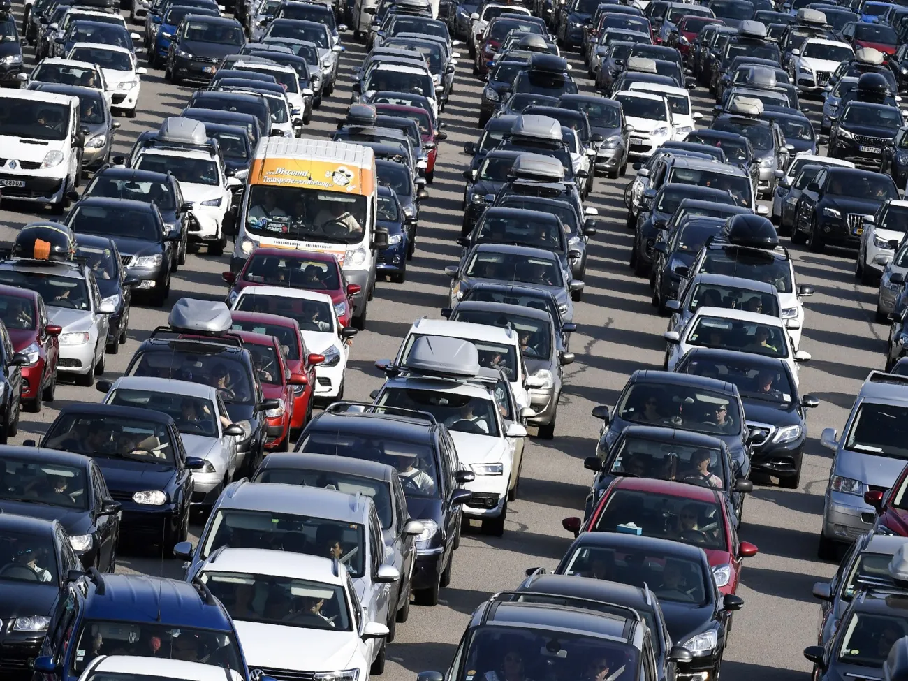 Motorists wait to&nbsp;enter&nbsp;a toll station on the A7 motorway near Vienne.