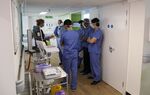 Staff gather for a briefing on a Covid-19 recovery ward at Wexham Park Hospital, operated by Frimley Health NHS Foundation Trust, near Slough, U.K., on Friday, May 22, 2020. 