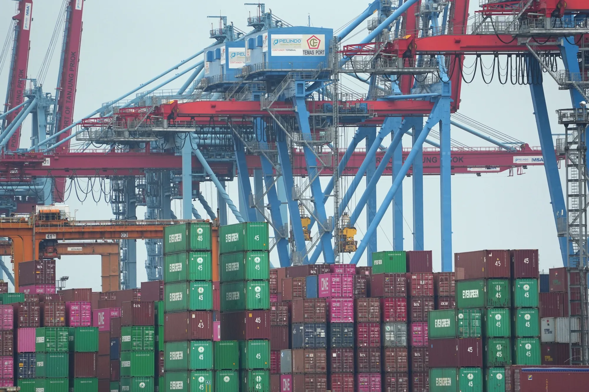 Stacked shipping containers at Tanjung Priok port in Jakarta.