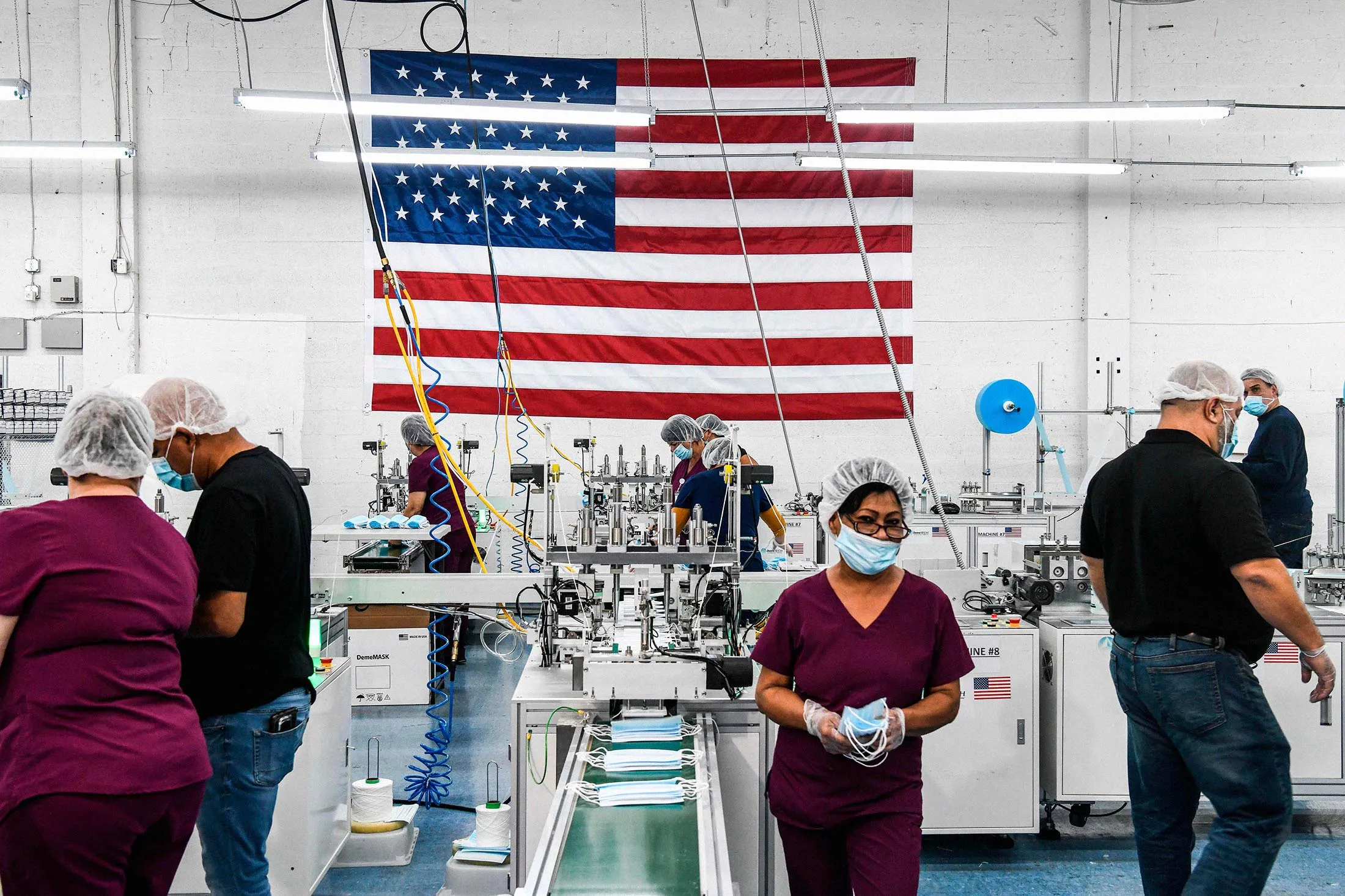 Making masks at DemeTech, which has laid off 1,500 people.