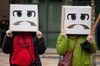Demonstrators wear costumes during a protest at Amazon’s Seattle headquarters on Dec. 16