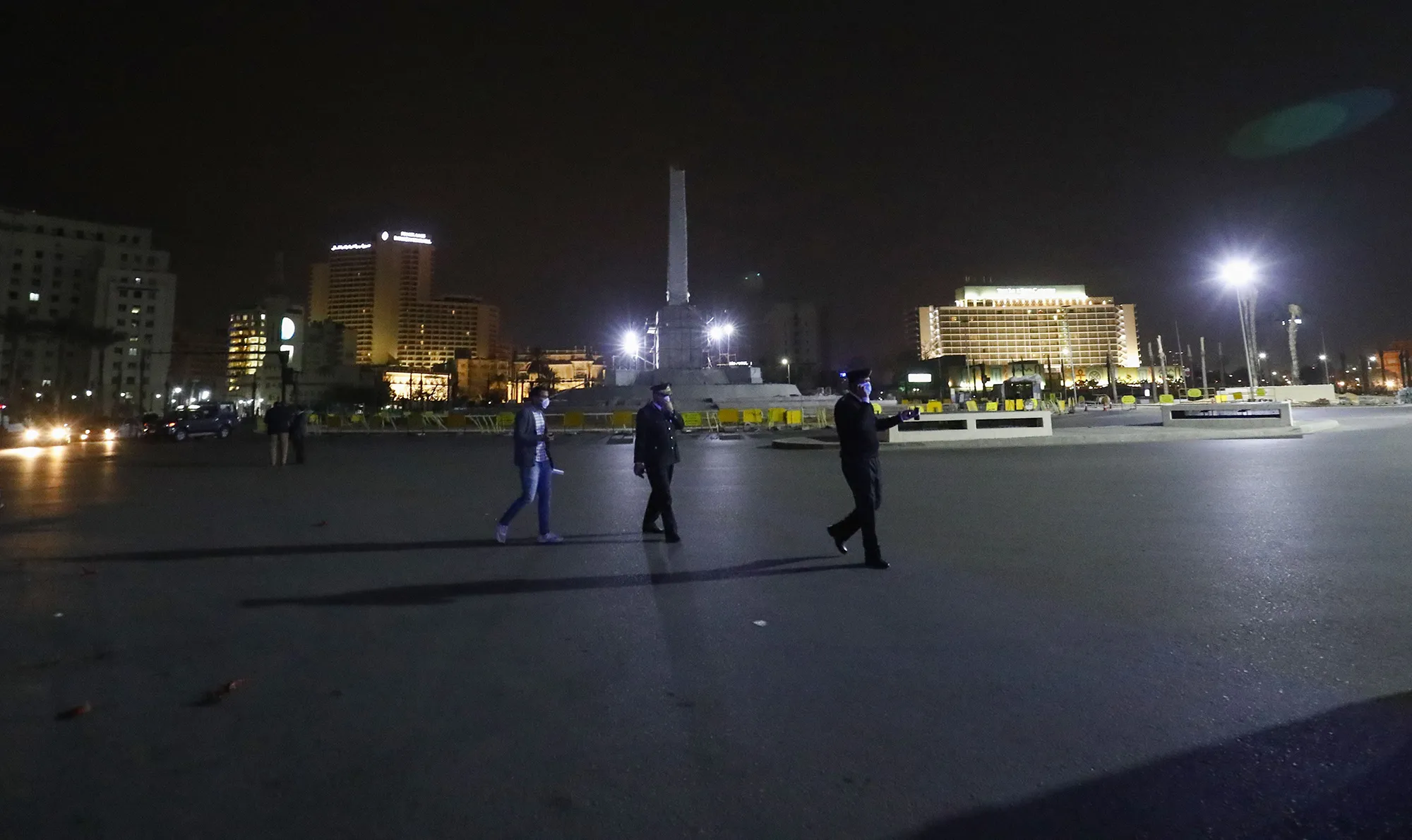 Pedestrians&nbsp;in a nearly empty Tahrir Square in Cairo&nbsp;on March 25.&nbsp;