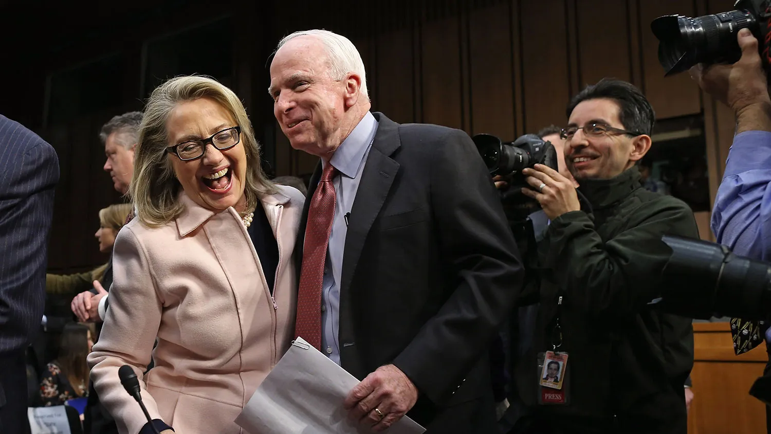 U.S. Secretary of State Hillary Clinton (L) and Sen. John McCain (R-AZ) joke and embrace before Sen. John Kerry's (D-MA) confirmation hearing before the Senate Foreign Relations Committee to become the next Secretary of State in the Hart Senate Office Building on Capitol Hill January 24, 2013 in Washington, DC.
