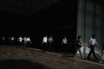 Pedestrians walk towards the entrance of Tokyo Station in Tokyo, Japan, on Aug. 7, 2020.